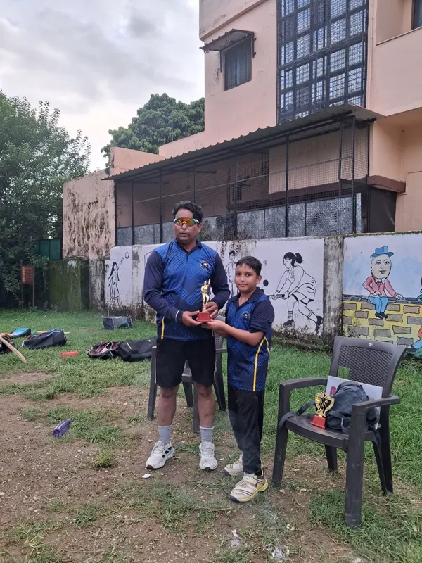 Two academy players together beside the practice ground